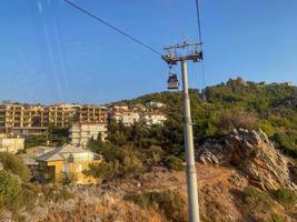 Modern beautiful cable car, lift, funicular in the mountains on vacation in a warm tropical eastern paradise country southern resort photo