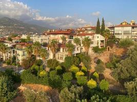 A beautiful tourist city with modern buildings on a mountain with trees on vacation in a warm tropical oriental paradise country southern resort photo