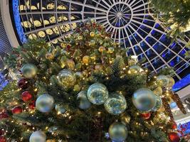 Toys on the Christmas tree. Christmas tree garlands photo