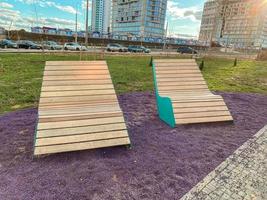 Sun white beds in the park. relax zone in the city. Improvement of public services, outdoor photo