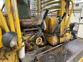 Construction vehicle cab interior with hill and sky in the sunny background photo