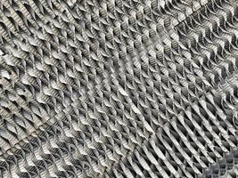 The texture of the iron stainless metal grate of the nozzle of the plate for the industrial chemical column background photo