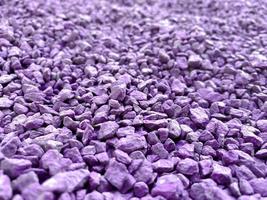 Small purple and pink bright loose stones fashionable sharp beautiful used for decoration and landscape design. The background. Texture photo