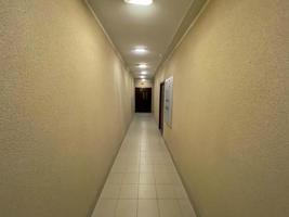 Long Corridor With Metal Doors, Tilled Wall And Floor photo