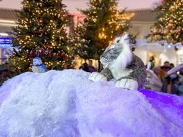 cute soft toy tiger with decorations on a cozy Christmas or New Year background. symbol of 2022, oriental calendar concept photo