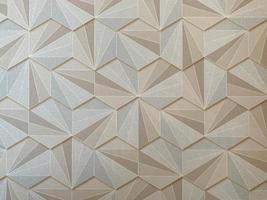 Texture abstract from many geometric shapes of yellow gold color hexagons. The background photo