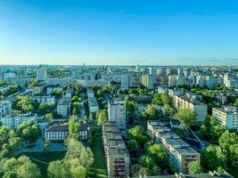panorama of the city from above. tall residential buildings. near a green park, a lot of trees. city view. a place where people live, a beautiful view from a height photo