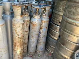 Technician inspecting gas canisters for welding in production line process. Quality Control Assurance concepts photo