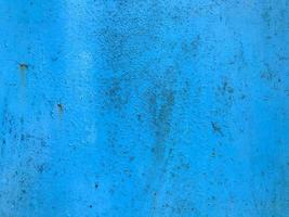 texture in blue. bright, matte surface of unusual color. metal sheet with paint smudges, damage, corrosion and rust. home decoration, decor, paint walls and home photo