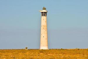 Lighthouse by the sea photo