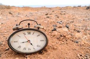 Clock on desert photo