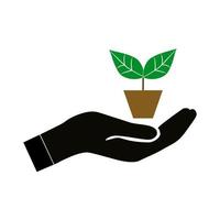 mano que sostiene el icono de la planta verde. vector