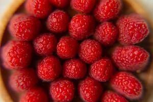 Raspberry close-up on a beautiful stand, summer fruit. photo
