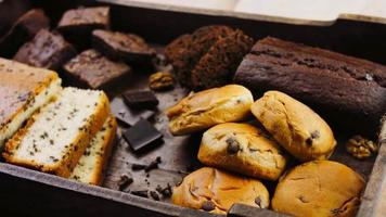 Different kinds of cakes arranged on a wooden tray video