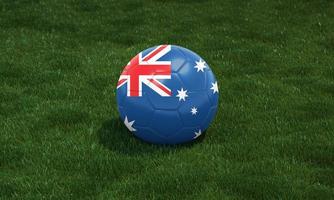 pelota de fútbol con los colores de la bandera de australia en un estadio sobre fondo de pastos verdes. foto