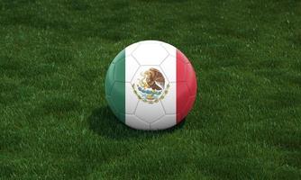 Soccer ball with Mexico flag colors at a stadium on green grasses background. photo