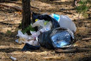 Lot plastic and food waste forest, pollution environment and forests. photo