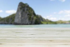 Template empty top table view with sea view and blue sky blur effect background photo