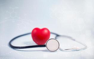 Concept stethoscope and red heart with Health insurance, doctor stethoscope and red heart check heart health care, instrument for checking heart on the white background represents exercise, isolated photo