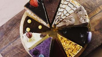 Ten kinds of cakes on a golden tray and on a wooden tray with decorations video