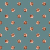 Seamless pattern of Christmas candies on blue background vector