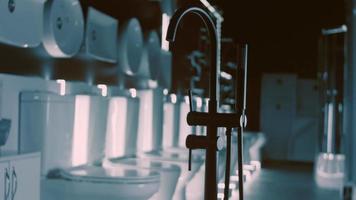 Rotating washbasin. Studio filming. In the background a row of toilets. 4k video