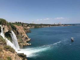 Beautiful waterfall falling into the sea. Big Waterfall photo