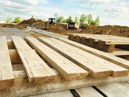 wooden pallets at the construction site. natural material for carrying heavy objects at the construction site. pallet made of yellow with a smooth surface photo