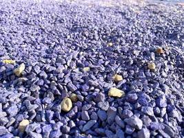 Purple stone pebbles as abstract background texture, landscape architecture backdrop, interior design and textured pattern photo
