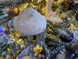 A beautiful decorated Christmas tree with lights and different toys photo