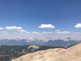 Beautiful landscape view from a high mountain to the forest and mountains in a tropical country with resorts and the sea photo