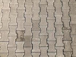 Scratched grey square road tiles texture photo
