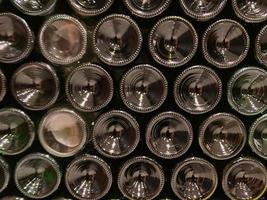 The bottoms of empty green glass bottles photo