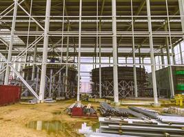 metal structure at the construction site. construction of a complex for the extraction of minerals from the earth. warehouse for building materials photo