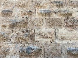 textura de un muro de piedra hecho de grandes bloques. elementos del edificio de la antigüedad antigua