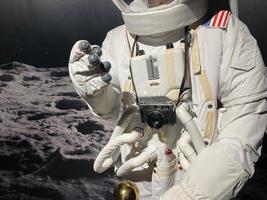 Astronaut with a camera makes a photo. The elements of this image furnished by NASA photo