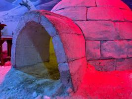 An igloo made of snow like a house photo