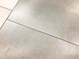 texture, floor and wall tiles. gray tiles with a concrete gap inside. single-coloured natural stone effect tiles with a slight sheen to cover surfaces photo