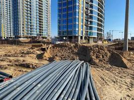 Large industrial black plastic polypropylene modern large diameter plumbing plumbing pipes at construction site in water pipe laying and construction and renovation of buildings and houses photo