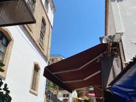 Building architecture in old town of Split. Rooftops with communications photo