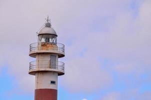 Lighthouse by the sea photo