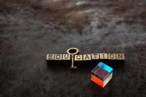 Prism beside Love shaped padlock, key and education wording photo