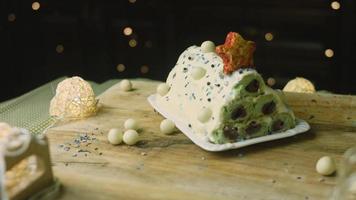 Cake with green dough, sour cherries and sour cream. It also has food ornament and the red star cake video