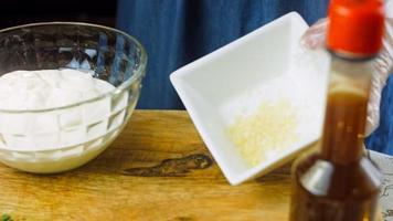 Macro filming of Worcestershire sauce. The chef pours the sauce into a spoon video