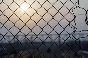 Mesh Fence with Sunrise photo