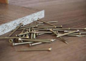 wood screws on manufactured wood panel photo