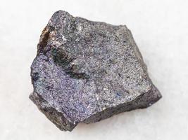 raw bornite stone on white photo