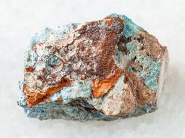 rough Scorodite stone on white photo