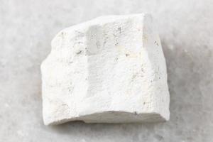 rough Chalk stone on white marble