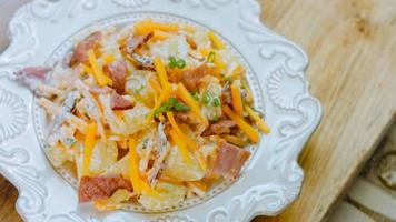 Jalapeno pepper, potato salad with bacon. Food in the retro style of the 20s video